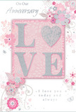 This anniversary card evokes the tenderness of a handwritten note left on the kitchen table in a Berrylands home, its design whispering of long-lasting affection. At its heart lies the word LOVE, each letter slightly raised so it stands proud from the soft background. The letters are coated in a silky, glittery texture in muted pastel pink, with edges kissed by delicate silver highlights. The letter O is transformed into a shimmering heart, filled with denser silver glitter that catches and reflects the light more strongly, making the centre of the card glow with quiet intensity. Around this focal point, delicate blooms unfurl in shades of blush, mauve, and pale rose, their petals softly shaded as though painted in watercolour. The outlines are fine and considered, resembling the care a florist takes when placing each stem in a romantic hand-tied arrangement. Slender vines and curling tendrils weave through the flowers, with tiny petals, elegant swirls, and discreet butterflies adding movement and a gentle sense of whimsy. The colour palette blends soft pastel pinks with silvery greys and clean whites, creating a feeling of treasured intimacy and calm, much like a peaceful stroll along the residential avenues of Berrylands at dusk. The text On Our Anniversary and I love you today and always is written in an understated, graceful script that harmonises with the artwork rather than overwhelming it. Together, the tactile lettering, the drifting florals, and the heartfelt message form a beautifully balanced keepsake-a card that feels as carefully composed as a bouquet delivered locally around Berrylands to celebrate a shared journey in love.
